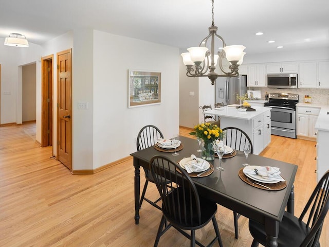 8118 Currant Pl, Eden Prairie, MN 55347 - dining room featuring a chandelier, light wood finished floors, and recessed lighting