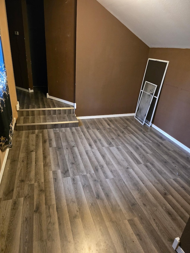 interior space featuring wood finished floors and baseboards
