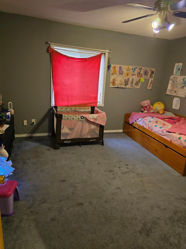 bedroom with ceiling fan, baseboards, and carpet floors