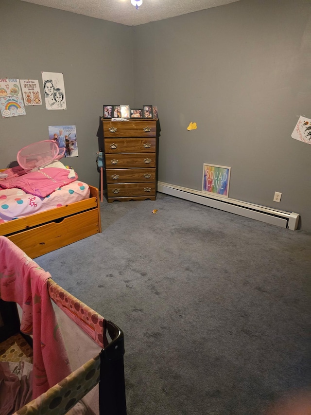 carpeted bedroom with a textured ceiling and a baseboard radiator