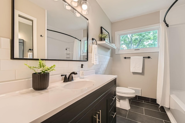 4 Battle Creek Ct, Saint Paul, MN 55119 - bathroom with tile patterned flooring, vanity, toilet, shower / tub combo, and backsplash