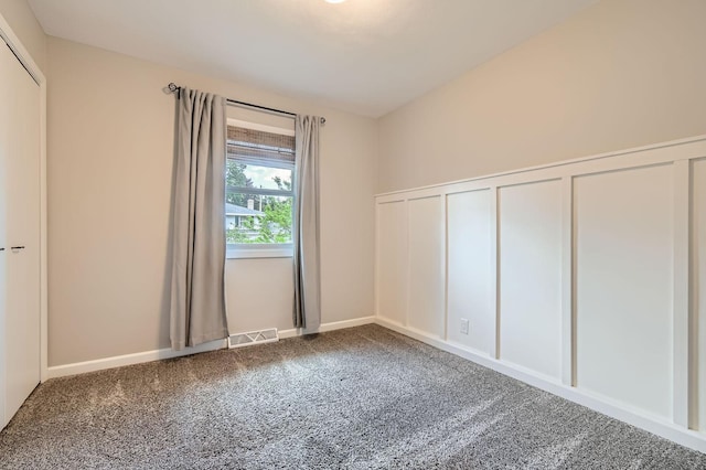 4 Battle Creek Ct, Saint Paul, MN 55119 - unfurnished bedroom featuring carpet flooring and a decorative wall
