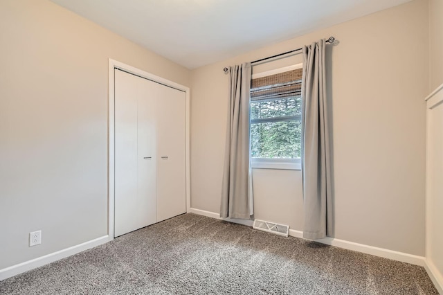 4 Battle Creek Ct, Saint Paul, MN 55119 - unfurnished bedroom featuring baseboards, carpet floors, and a closet