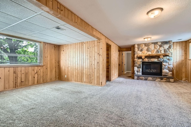 4 Battle Creek Ct, Saint Paul, MN 55119 - unfurnished living room featuring wooden walls, a fireplace, and carpet floors