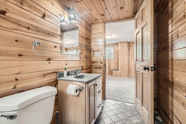4 Battle Creek Ct, Saint Paul, MN 55119 - bathroom with wood walls, toilet, vanity, and tile patterned flooring