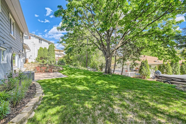 4 Battle Creek Ct, Saint Paul, MN 55119 - view of grassy yard with a patio area and central air condition unit