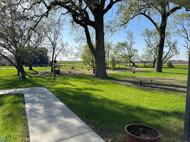 view of property's community with a lawn