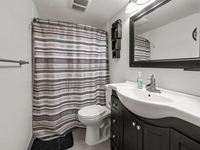 15029 Tyacke Dr, Burnsville, MN 55306 - full bathroom featuring toilet, curtained shower, vanity, tile patterned flooring, and visible vents