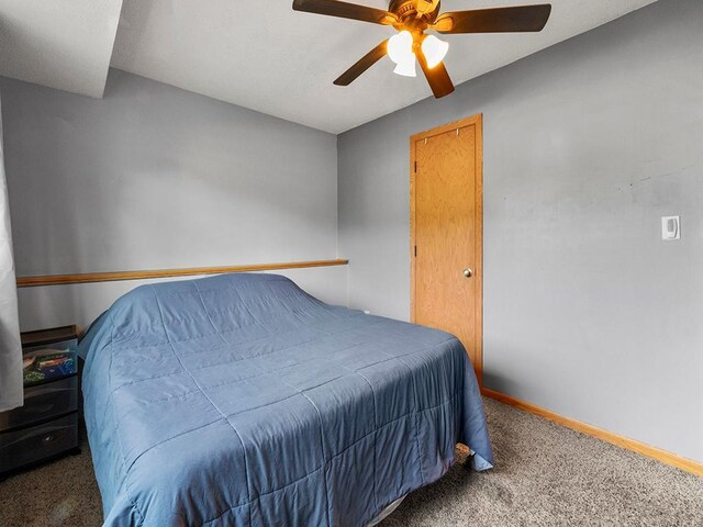 15029 Tyacke Dr, Burnsville, MN 55306 - carpeted bedroom featuring baseboards and ceiling fan