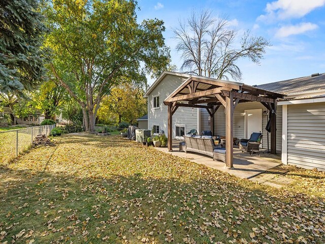 15029 Tyacke Dr, Burnsville, MN 55306 - view of yard featuring a fenced backyard, an outdoor hangout area, a patio area, and a pergola