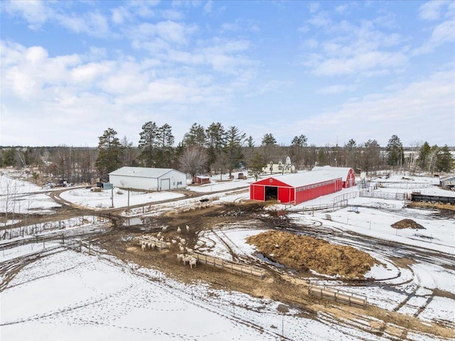 17430 280th St, Sebeka, MN 56477 - yard covered in snow featuring an outbuilding and view of scattered trees