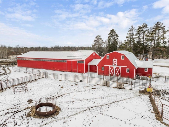 17430 280th St, Sebeka, MN 56477 - snowy yard with a barn, an outbuilding, and an exterior structure
