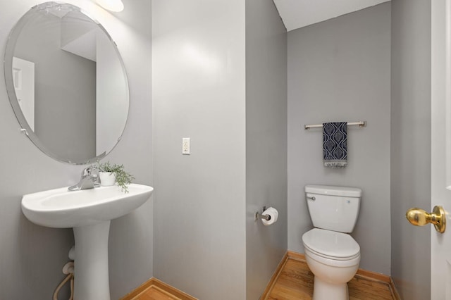 15767 Porchlight Ln, Eden Prairie, MN 55347 - bathroom featuring baseboards, wood finished floors, and toilet
