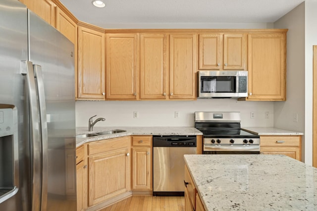 15767 Porchlight Ln, Eden Prairie, MN 55347 - kitchen featuring light wood finished floors, light brown cabinets, a sink, and stainless steel appliances