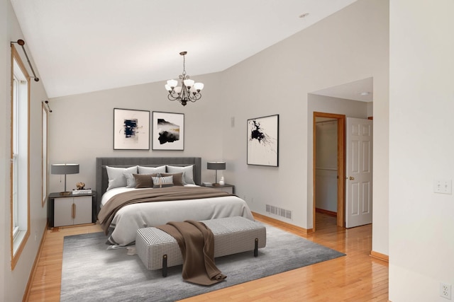 15767 Porchlight Ln, Eden Prairie, MN 55347 - bedroom with vaulted ceiling, a chandelier, light wood-type flooring, baseboards, and visible vents