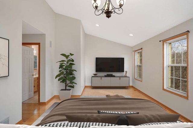 15767 Porchlight Ln, Eden Prairie, MN 55347 - living room featuring vaulted ceiling, a notable chandelier, wood finished floors, baseboards, and visible vents
