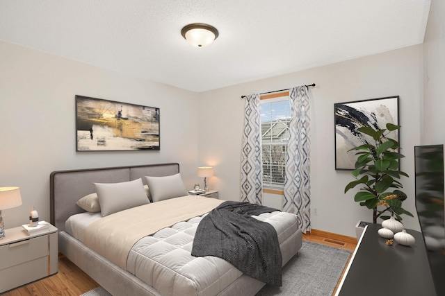 15767 Porchlight Ln, Eden Prairie, MN 55347 - bedroom featuring baseboards and light wood finished floors