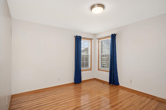 15767 Porchlight Ln, Eden Prairie, MN 55347 - unfurnished room with baseboards and light wood-style floors