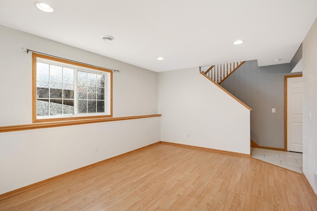 15767 Porchlight Ln, Eden Prairie, MN 55347 - spare room with recessed lighting, baseboards, stairs, and wood finished floors