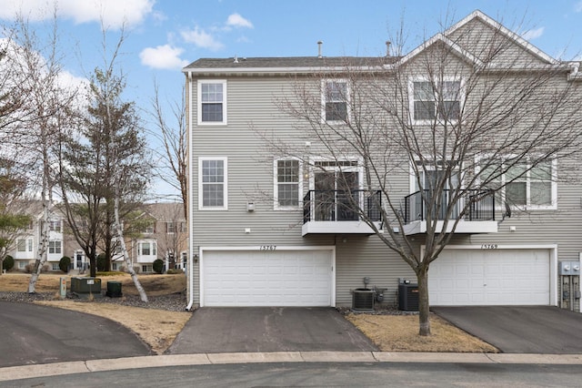 15767 Porchlight Ln, Eden Prairie, MN 55347 - view of front facade featuring a garage, central AC, and aphalt driveway