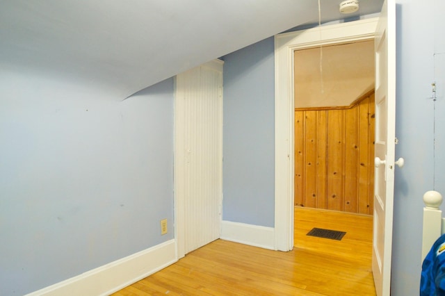 below grade area with wood finished floors and baseboards
