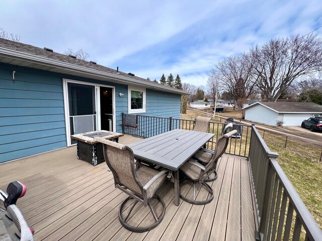 wooden deck featuring outdoor dining space
