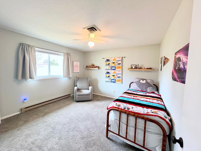 carpeted bedroom featuring a textured ceiling, visible vents, baseboards, a ceiling fan, and baseboard heating