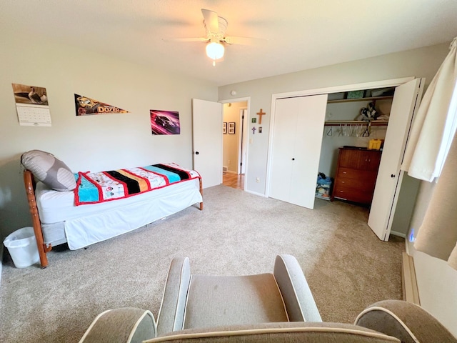 bedroom with a closet, carpet flooring, and a ceiling fan