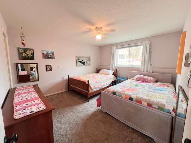 carpeted bedroom with baseboards, ceiling fan, and a textured ceiling