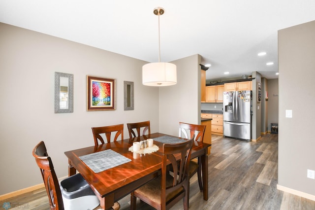 dining space with recessed lighting, baseboards, and dark wood-style floors