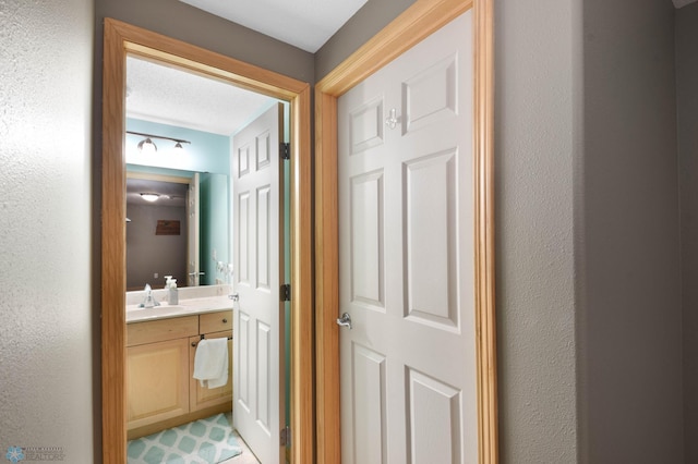 corridor featuring a sink
