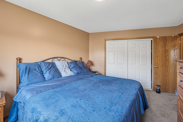 bedroom with carpet floors and a closet