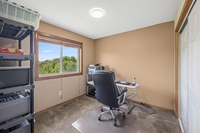 office space with carpet flooring and baseboards