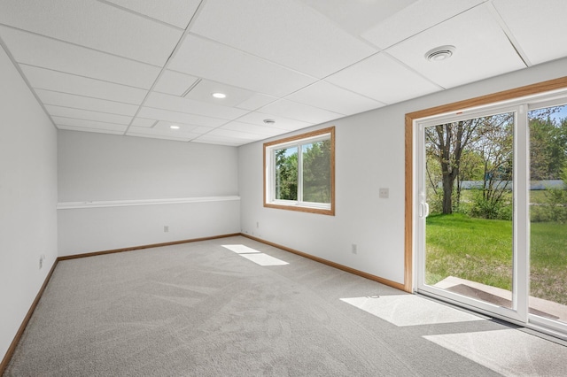 carpeted spare room with baseboards