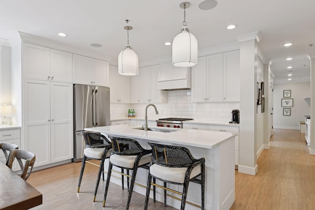 6112 Kellogg Unit 200D, Edina, MN 55424 - kitchen featuring a sink, freestanding refrigerator, light countertops, backsplash, and recessed lighting