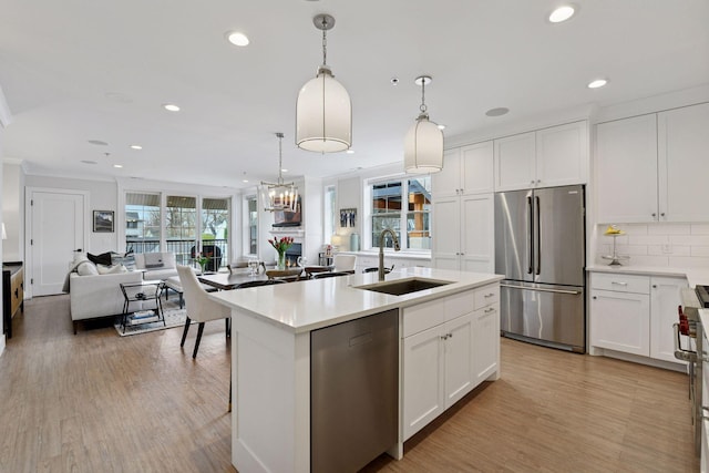 6112 Kellogg Unit 200D, Edina, MN 55424 - kitchen with stainless steel appliances, a sink, recessed lighting, open floor plan, and backsplash