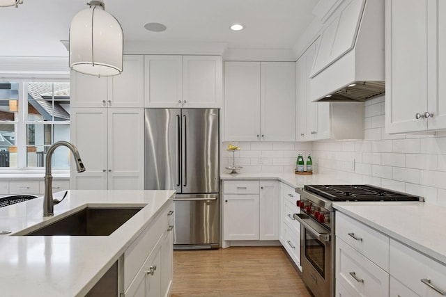 6112 Kellogg Unit 200D, Edina, MN 55424 - kitchen with stainless steel appliances, custom exhaust hood, a sink, white cabinets, and recessed lighting