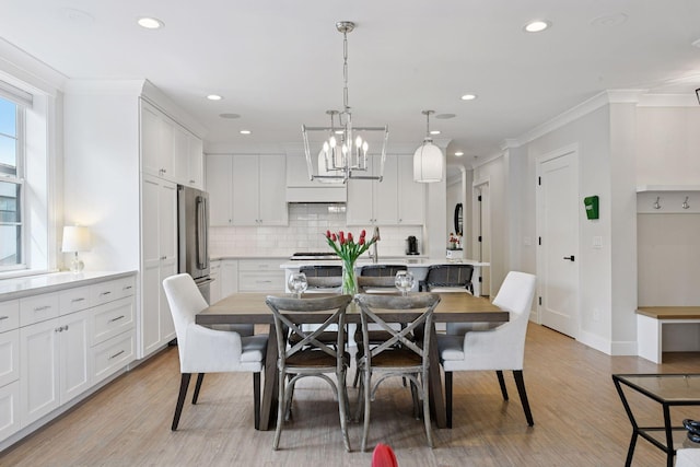 6112 Kellogg Unit 200D, Edina, MN 55424 - dining area with crown molding, light wood-style flooring, recessed lighting, a chandelier, and baseboards