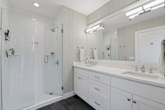 6112 Kellogg Unit 200D, Edina, MN 55424 - bathroom featuring a shower stall, double vanity, marble finish flooring, and wallpapered walls