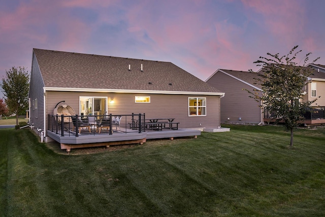 630 Stonegate Cir, Waconia, MN 55387 - back of property with a wooden deck, a lawn, and roof with shingles