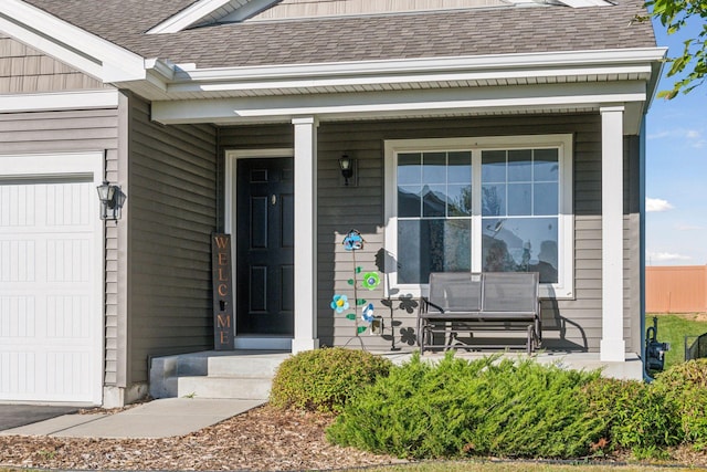 630 Stonegate Cir, Waconia, MN 55387 - property entrance featuring covered porch, a shingled roof, and a garage