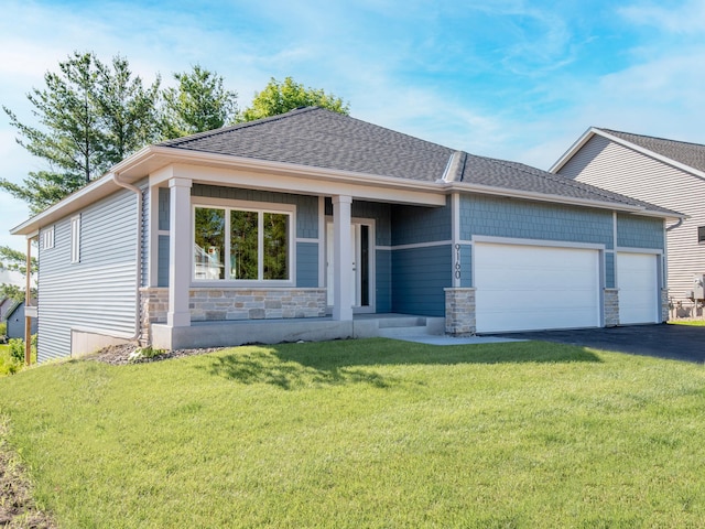9160 62nd St S, Cottage Grove, MN 55016 - ranch-style house with stone siding, a garage, driveway, a front lawn, and a shingled roof