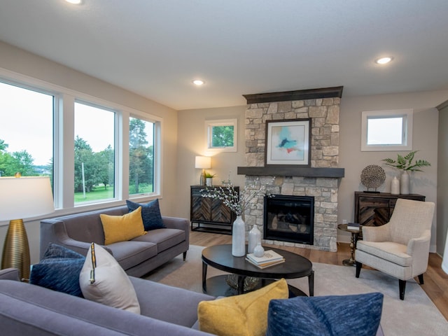 9160 62nd St S, Cottage Grove, MN 55016 - living room featuring wood finished floors, recessed lighting, and a stone fireplace