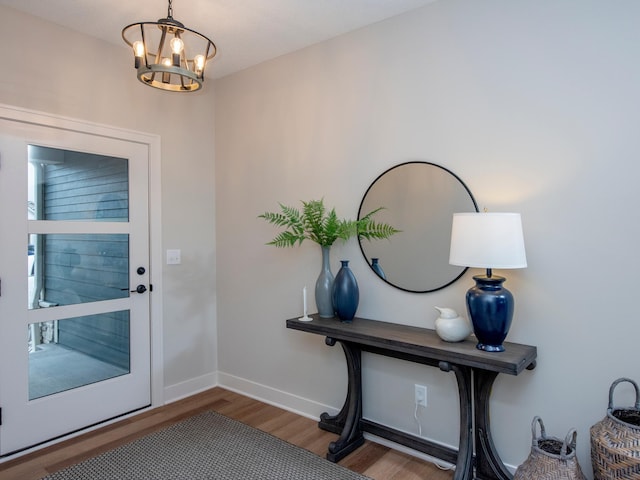 9160 62nd St S, Cottage Grove, MN 55016 - doorway featuring wood finished floors and a chandelier
