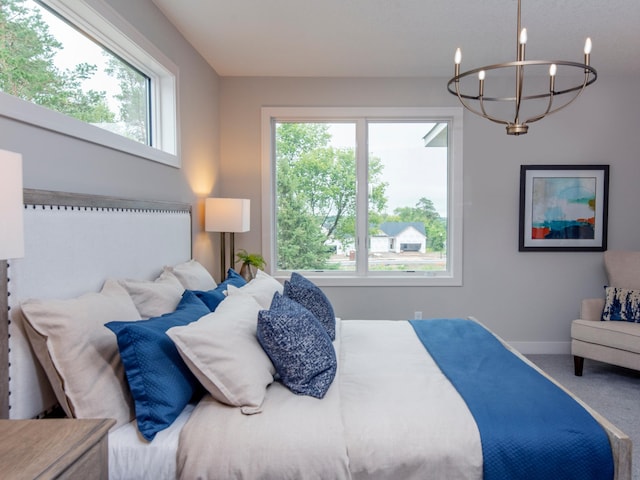 9160 62nd St S, Cottage Grove, MN 55016 - carpeted bedroom with a chandelier and baseboards