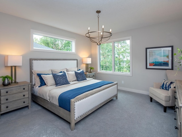 9160 62nd St S, Cottage Grove, MN 55016 - carpeted bedroom with a chandelier and baseboards