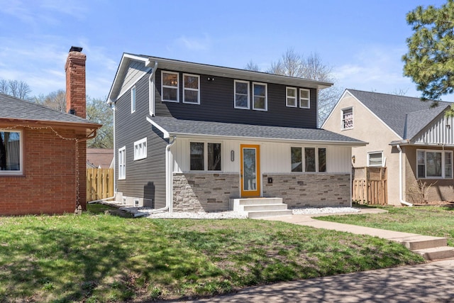 4015 Queen Ave N, Minneapolis, MN 55412 - view of front of property featuring fence, entry steps, a front lawn, and stone siding