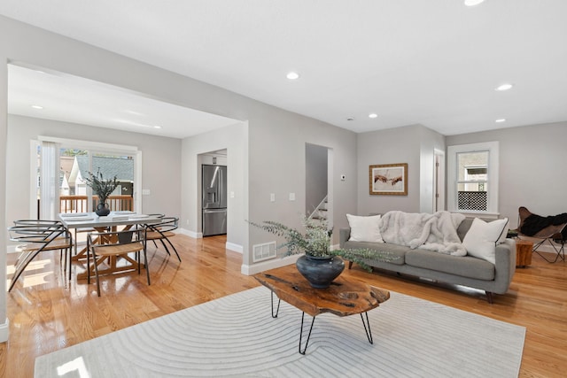 4015 Queen Ave N, Minneapolis, MN 55412 - living area with visible vents, recessed lighting, stairway, light wood-style flooring, and baseboards