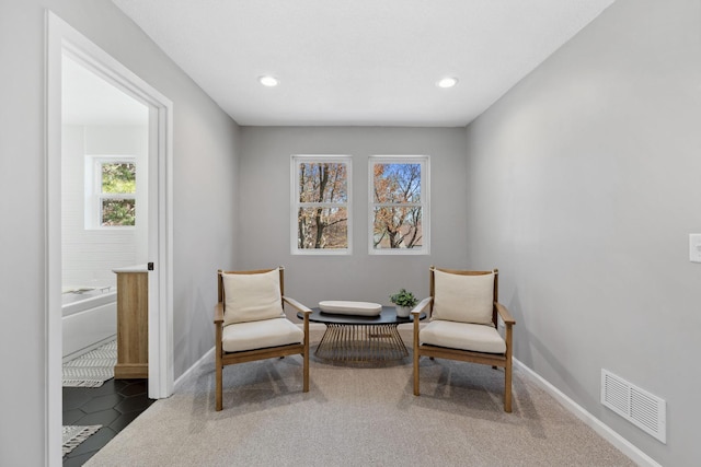 4015 Queen Ave N, Minneapolis, MN 55412 - living area with baseboards, a healthy amount of sunlight, visible vents, and carpet