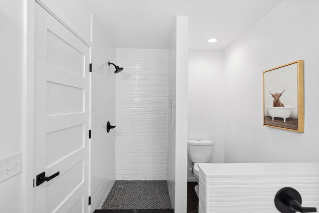 4015 Queen Ave N, Minneapolis, MN 55412 - bathroom with toilet, tile patterned flooring, tiled shower, and recessed lighting